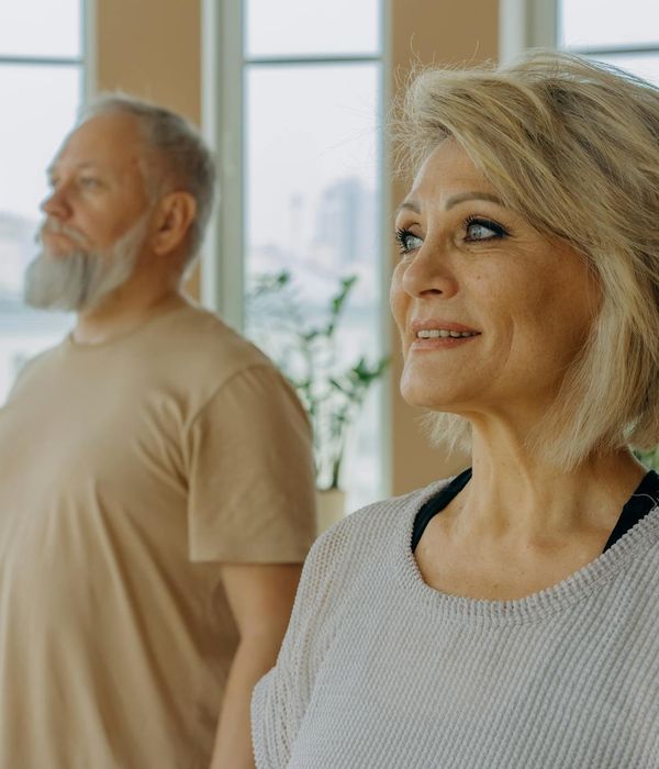 Man in a meditative pose focusing before a workout.
